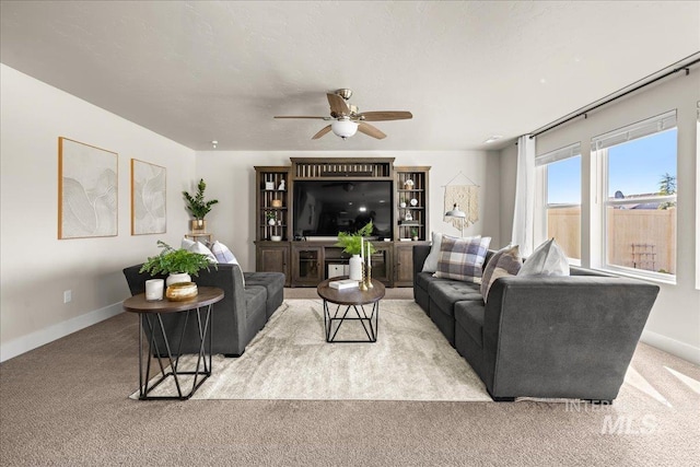 4447 W Everest St, Meridian, ID 83646 - living area featuring ceiling fan, light colored carpet, and baseboards