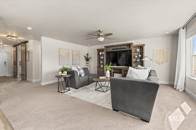 4447 W Everest St, Meridian, ID 83646 - living area featuring a ceiling fan, baseboards, and light carpet