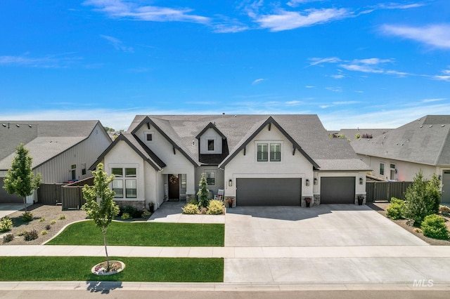 5209 W Strant Steet, Eagle, ID 83616 - view of front facade featuring stucco siding, driveway, and stone siding