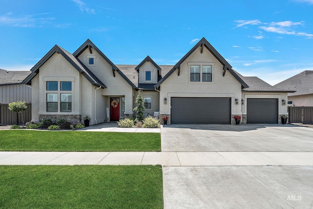 5209 W Strant Steet, Eagle, ID 83616 - french provincial home with stone siding, stucco siding, driveway, and an attached garage