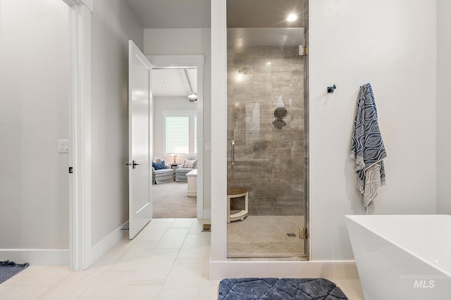 5209 W Strant Steet, Eagle, ID 83616 - bathroom featuring a stall shower, a freestanding bath, and tile patterned floors