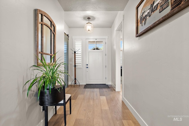 5209 W Strant Steet, Eagle, ID 83616 - foyer entrance with light wood-type flooring and a textured ceiling