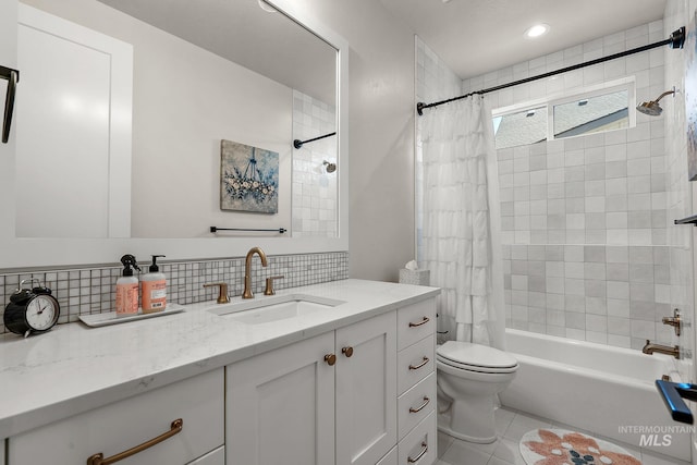 5209 W Strant Steet, Eagle, ID 83616 - full bathroom with shower / bath combo, vanity, tile patterned floors, and decorative backsplash