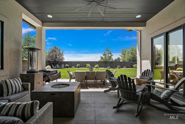 5209 W Strant Steet, Eagle, ID 83616 - fenced backyard with an outdoor living space with a fire pit, ceiling fan, and a patio