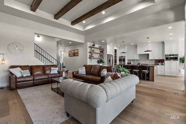 5209 W Strant Steet, Eagle, ID 83616 - living room with light wood-style flooring, recessed lighting, beam ceiling, and stairway