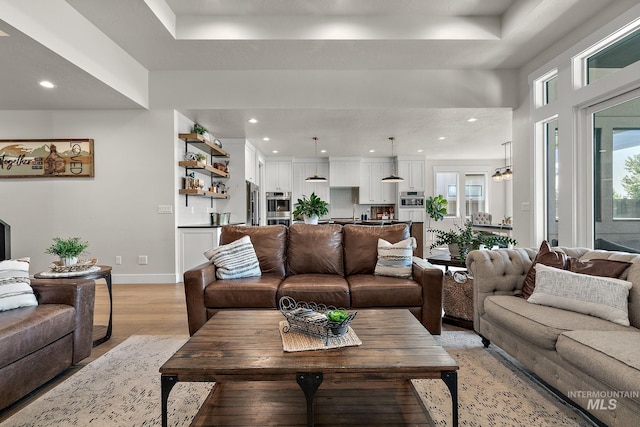 5209 W Strant Steet, Eagle, ID 83616 - living room featuring light wood-style floors, healthy amount of natural light, and recessed lighting