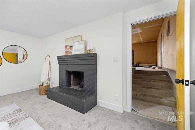 living room with light carpet and a brick fireplace