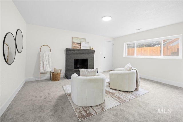 living room with a fireplace and light colored carpet