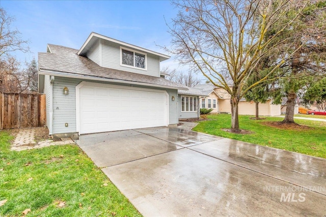 front facade featuring a front yard and a garage