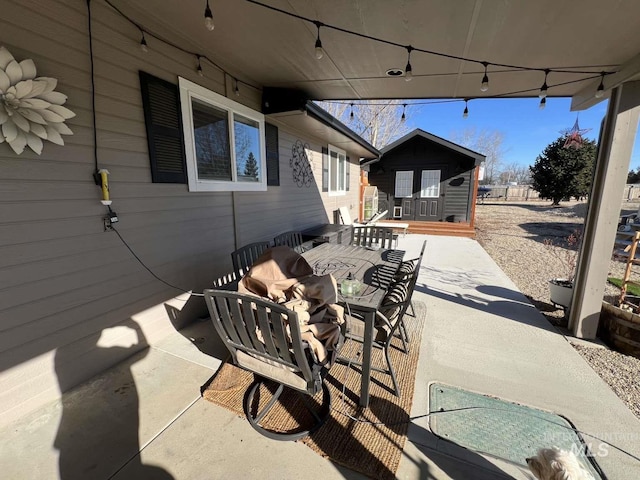 view of patio / terrace featuring an outbuilding