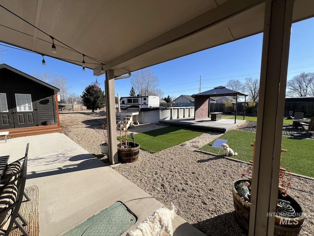 view of patio featuring a gazebo and a fenced backyard