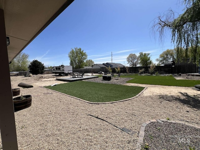 view of yard with a patio area and a fenced backyard