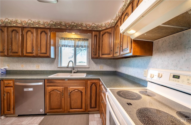 50 S 200 W, Jerome, ID 83338 - kitchen with white electric range oven, brown cabinets, stainless steel dishwasher, a sink, and under cabinet range hood