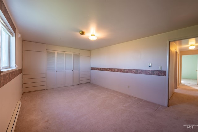 50 S 200 W, Jerome, ID 83338 - unfurnished bedroom with baseboard heating, a closet, and light colored carpet