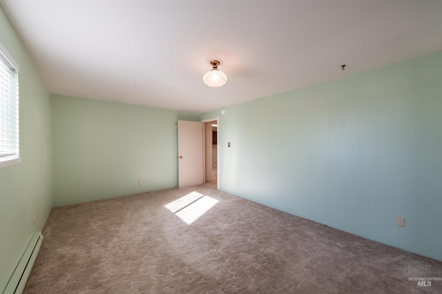 50 S 200 W, Jerome, ID 83338 - empty room with a baseboard heating unit and carpet floors