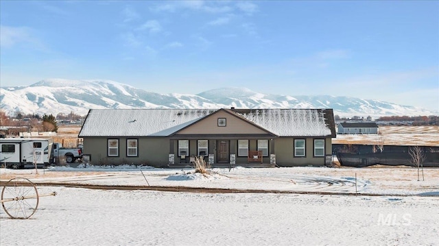 view of front of home featuring a mountain view and covered porch