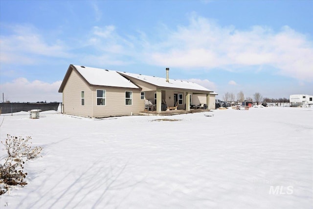 view of snow covered property