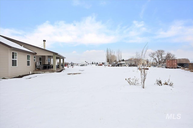 view of yard covered in snow