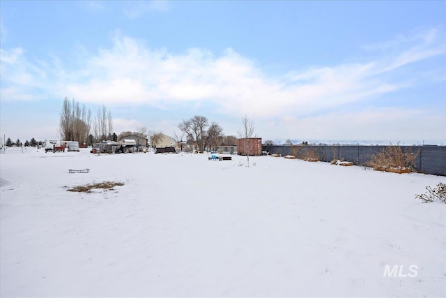 view of yard layered in snow