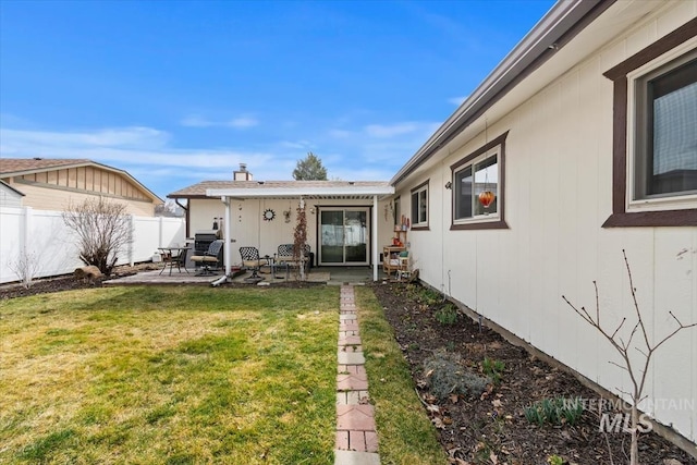 view of yard with a patio and fence