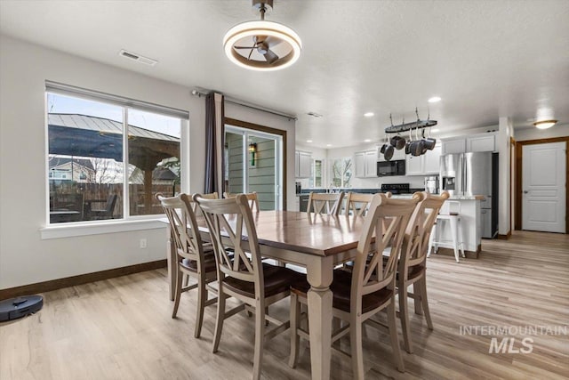 dining room featuring light hardwood / wood-style floors