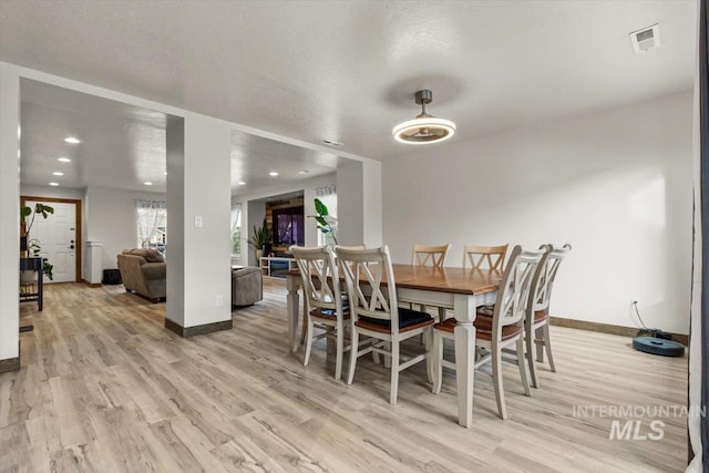 dining room with light hardwood / wood-style flooring