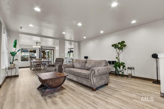 living room with light hardwood / wood-style flooring