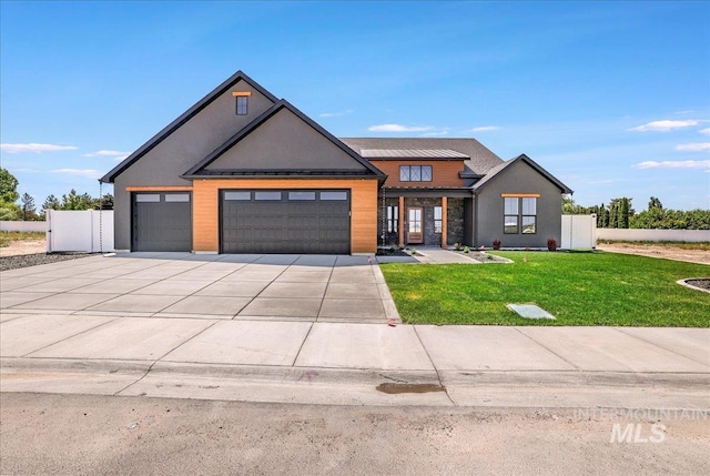 3160 Crescent Moon Rd, Twin Falls, ID 83301 - view of front of house featuring a garage, concrete driveway, and stucco siding