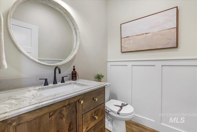 3160 Crescent Moon Rd, Twin Falls, ID 83301 - half bathroom featuring vanity and wood finished floors