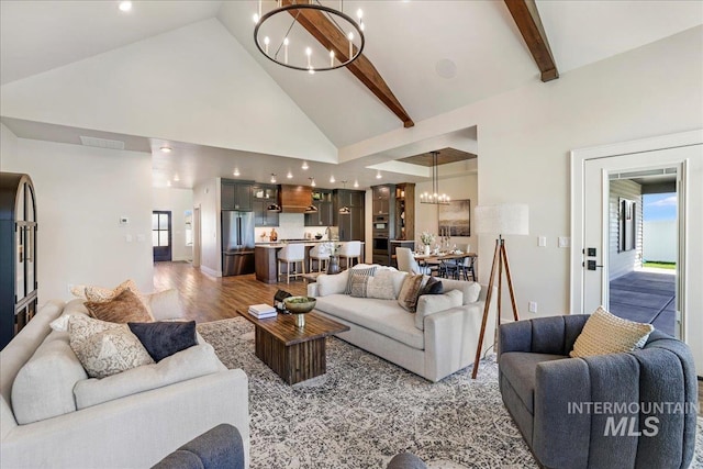 3160 Crescent Moon Rd, Twin Falls, ID 83301 - living area with a chandelier, high vaulted ceiling, wood finished floors, beamed ceiling, and recessed lighting