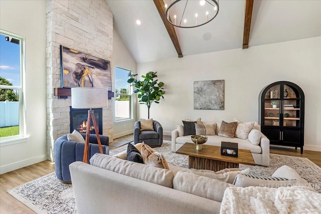 3160 Crescent Moon Rd, Twin Falls, ID 83301 - living room with beamed ceiling, a fireplace, wood finished floors, a chandelier, and recessed lighting