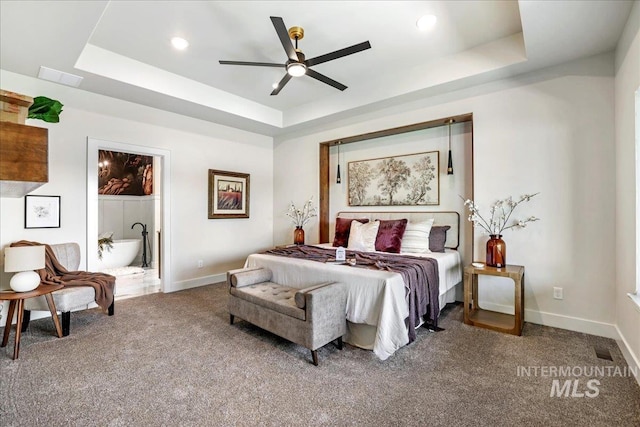 3160 Crescent Moon Rd, Twin Falls, ID 83301 - carpeted bedroom featuring a raised ceiling, ensuite bath, recessed lighting, and a ceiling fan