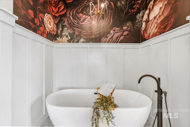 3160 Crescent Moon Rd, Twin Falls, ID 83301 - detailed view of a decorative wall, a freestanding tub, and a wainscoted wall