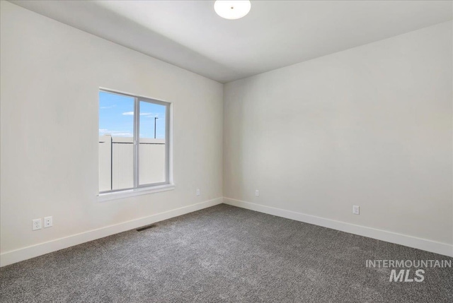 3160 Crescent Moon Rd, Twin Falls, ID 83301 - empty room with baseboards and dark colored carpet