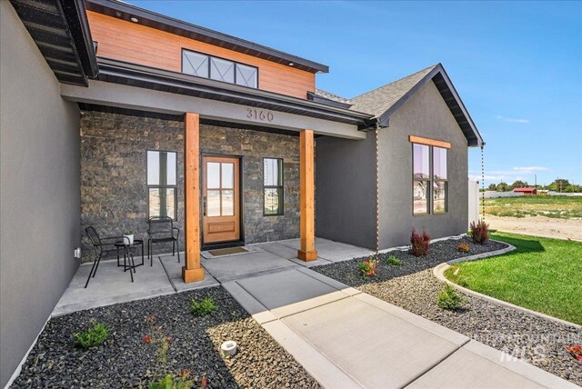 3160 Crescent Moon Rd, Twin Falls, ID 83301 - view of exterior entry featuring stone siding and stucco siding