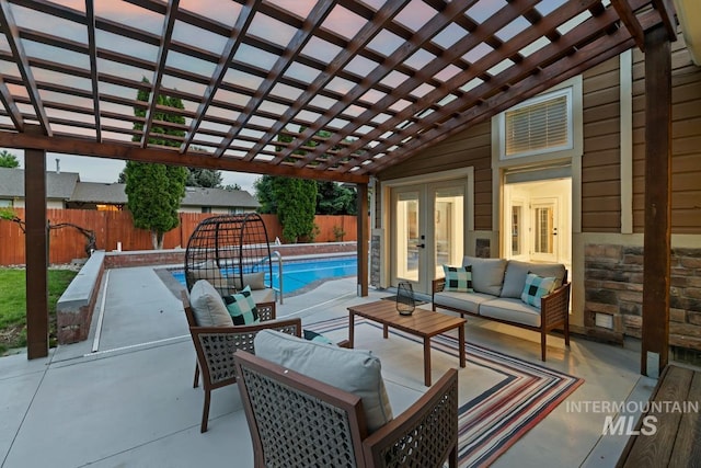 7913 W War Bonnet Dr, Boise, ID 83709 - fenced backyard with outdoor lounge area, a pergola, a patio, and french doors