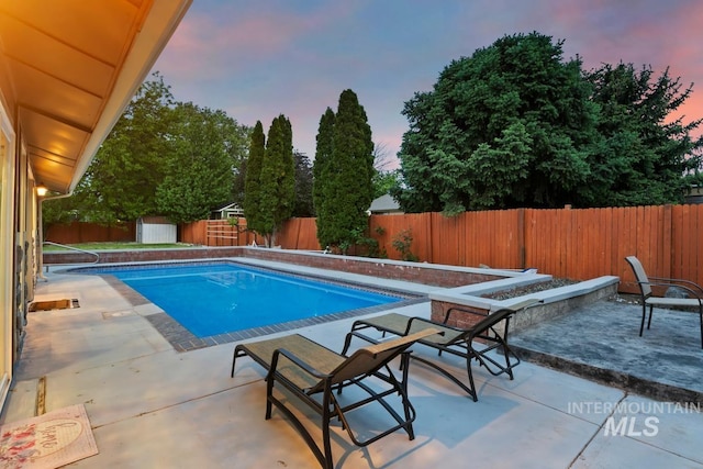 7913 W War Bonnet Dr, Boise, ID 83709 - view of swimming pool featuring an outdoor fire pit, a patio, and a fenced backyard