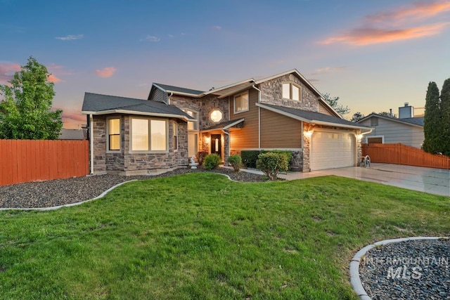 7913 W War Bonnet Dr, Boise, ID 83709 - view of front of home featuring stone siding, driveway, and a garage
