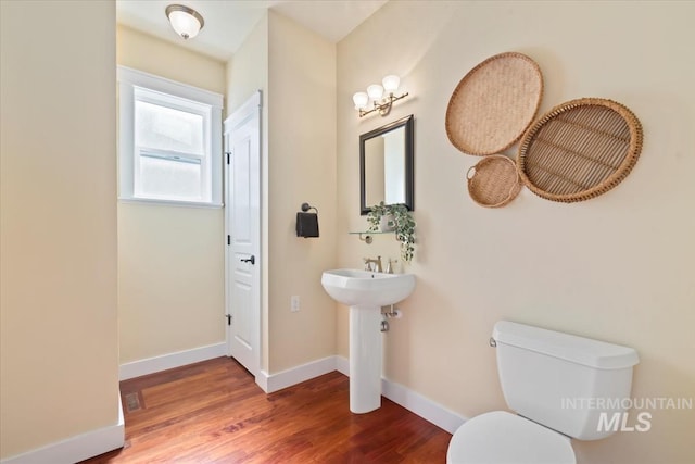 187 E Wishbone Ct, Boise, ID 83706 - bathroom featuring toilet, wood finished floors, and baseboards