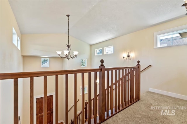 187 E Wishbone Ct, Boise, ID 83706 - corridor featuring an upstairs landing, carpet flooring, a chandelier, plenty of natural light, and vaulted ceiling