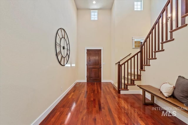 187 E Wishbone Ct, Boise, ID 83706 - entryway with a towering ceiling, baseboards, wood finished floors, and stairway