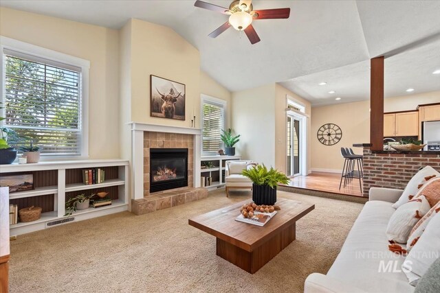 187 E Wishbone Ct, Boise, ID 83706 - carpeted living room featuring a fireplace, a ceiling fan, vaulted ceiling, and recessed lighting