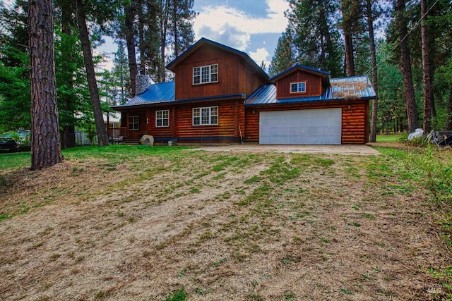 14 Sunrise Dr, Garden Valley, ID 83622 - log cabin featuring a garage, driveway, and metal roof