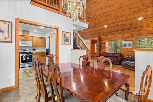 14 Sunrise Dr, Garden Valley, ID 83622 - dining area with recessed lighting, stairs, a high ceiling, and a notable chandelier
