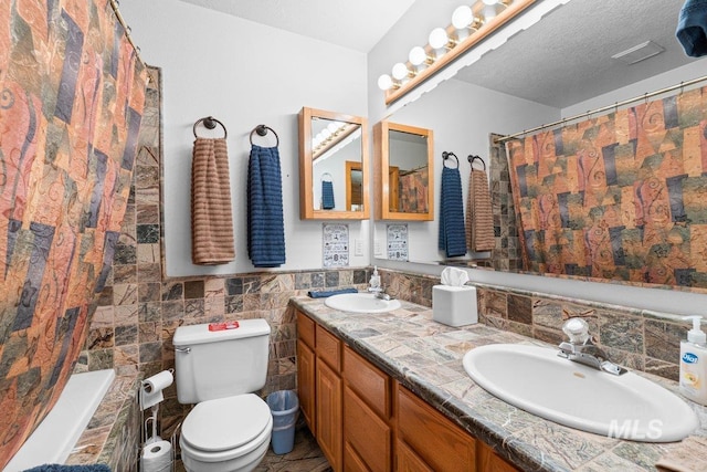 14 Sunrise Dr, Garden Valley, ID 83622 - full bath featuring a sink, double vanity, toilet, and curtained shower