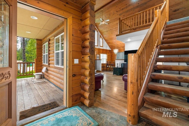 14 Sunrise Dr, Garden Valley, ID 83622 - stairs featuring ceiling fan, wood finished floors, log walls, a high ceiling, and recessed lighting