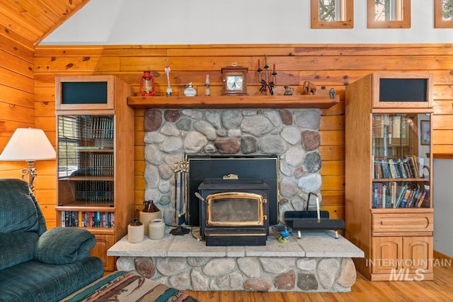 14 Sunrise Dr, Garden Valley, ID 83622 - room details with wood walls, wood finished floors, and a wood stove