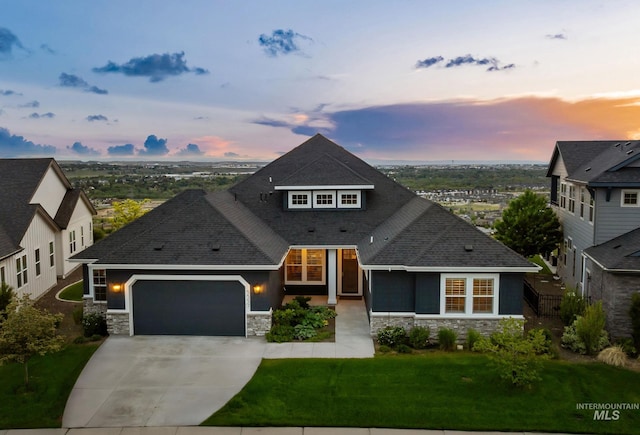5557 E Hootowl Dr, Boise, ID 83716 - view of front facade featuring stone siding, an attached garage, a shingled roof, concrete driveway, and a front lawn