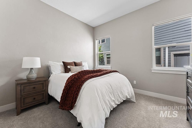 5557 E Hootowl Dr, Boise, ID 83716 - bedroom featuring baseboards and light colored carpet