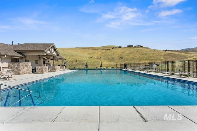 5557 E Hootowl Dr, Boise, ID 83716 - community pool with a patio
